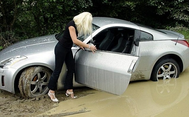 Blonde woman stuck in mud